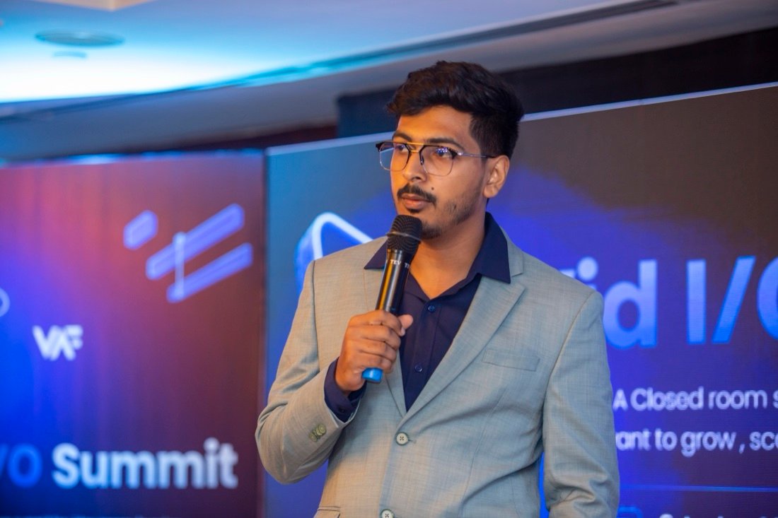 Istiak Ahmed speaking on stage with mic at VID I/O Summit 2026 Six Seasons Hotel Gulshan Dhaka